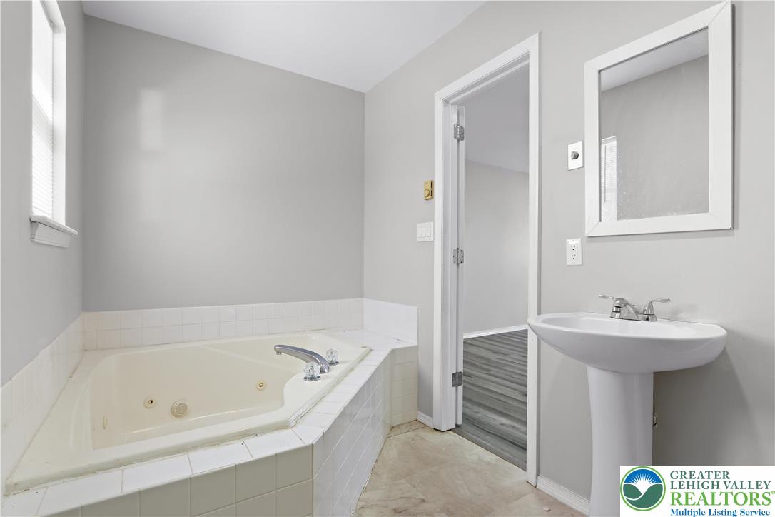 798 Sullivan Trail Scotrun, PA 18355 - Photo 31 of 46 a bathroom with a sink and a bathtub