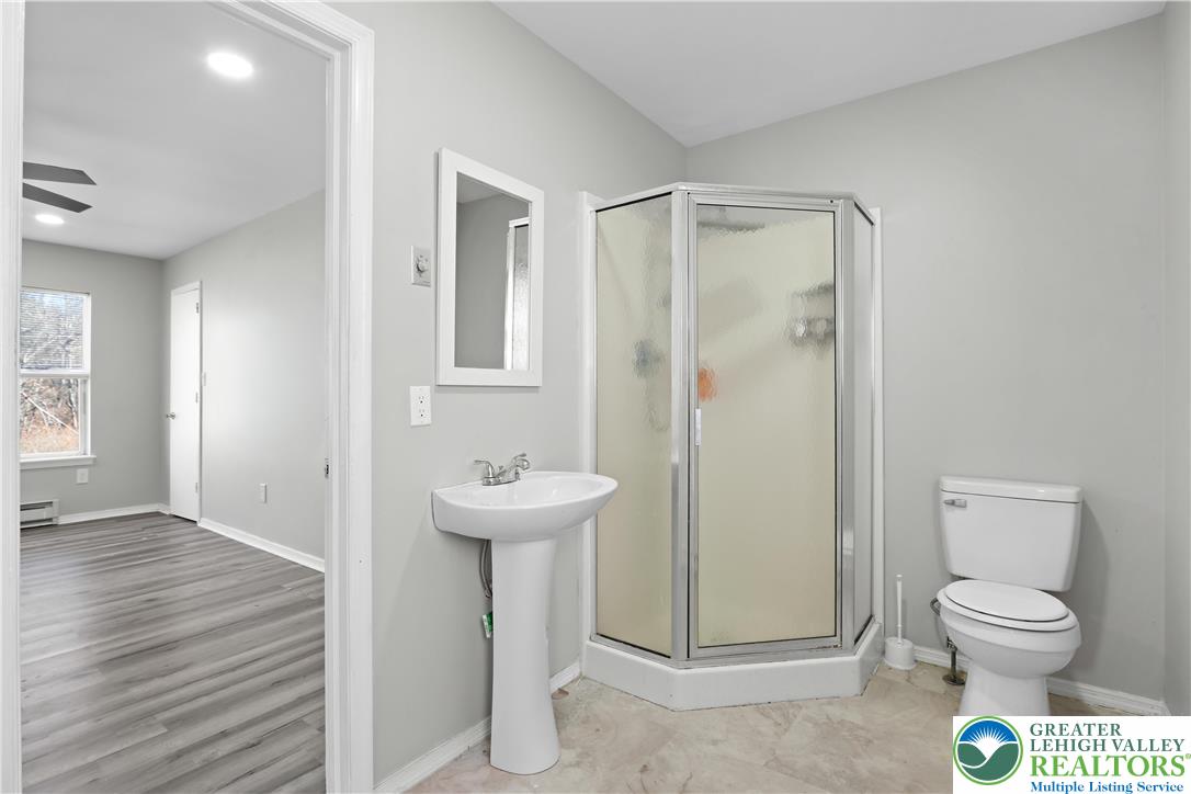 798 Sullivan Trail Scotrun, PA 18355 - Photo 32 of 46 a bathroom with a toilet a sink and shower