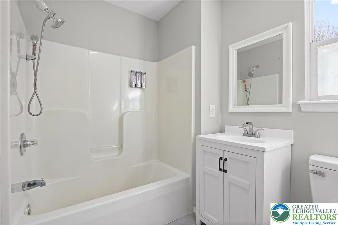 798 Sullivan Trail Scotrun, PA 18355 - Photo 35 of 46 a bathroom with a sink a toilet and a bathtub