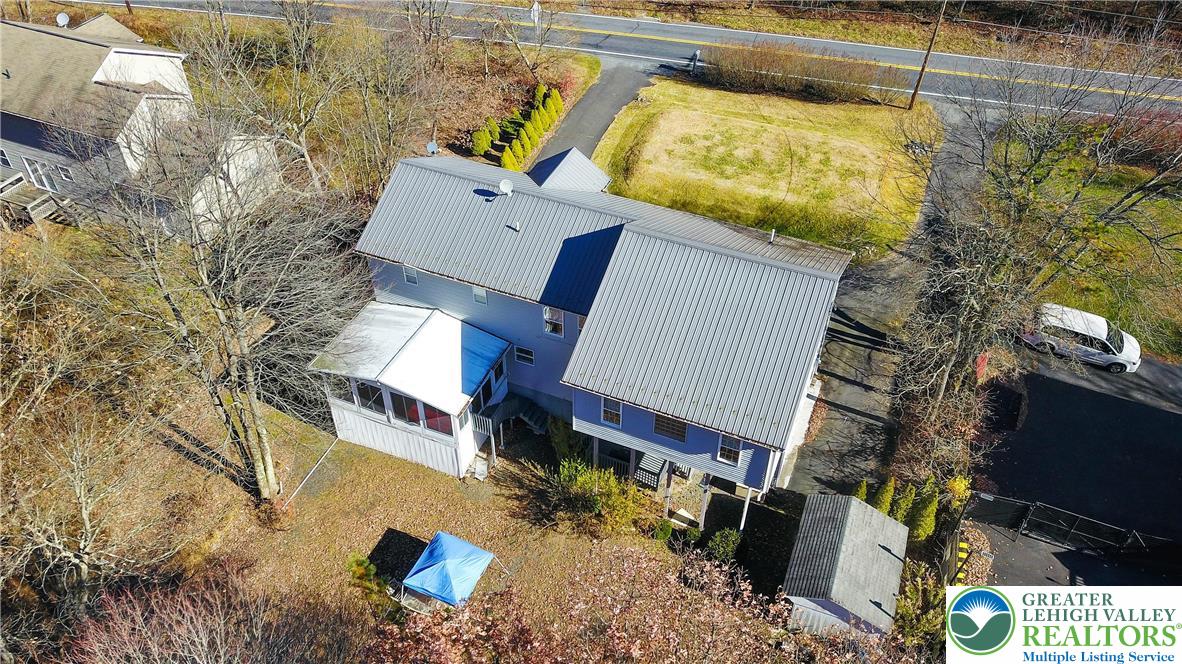 798 Sullivan Trail Scotrun, PA 18355 - Photo 43 of 46 a view of a house with a yard and sitting area
