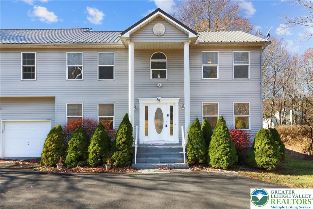 798 Sullivan Trail Scotrun, PA 18355 - Photo 5 of 46 a front view of a house with garden