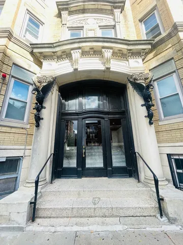 a view of a building with a street