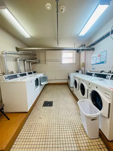 a kitchen that has a sink and a stove in it