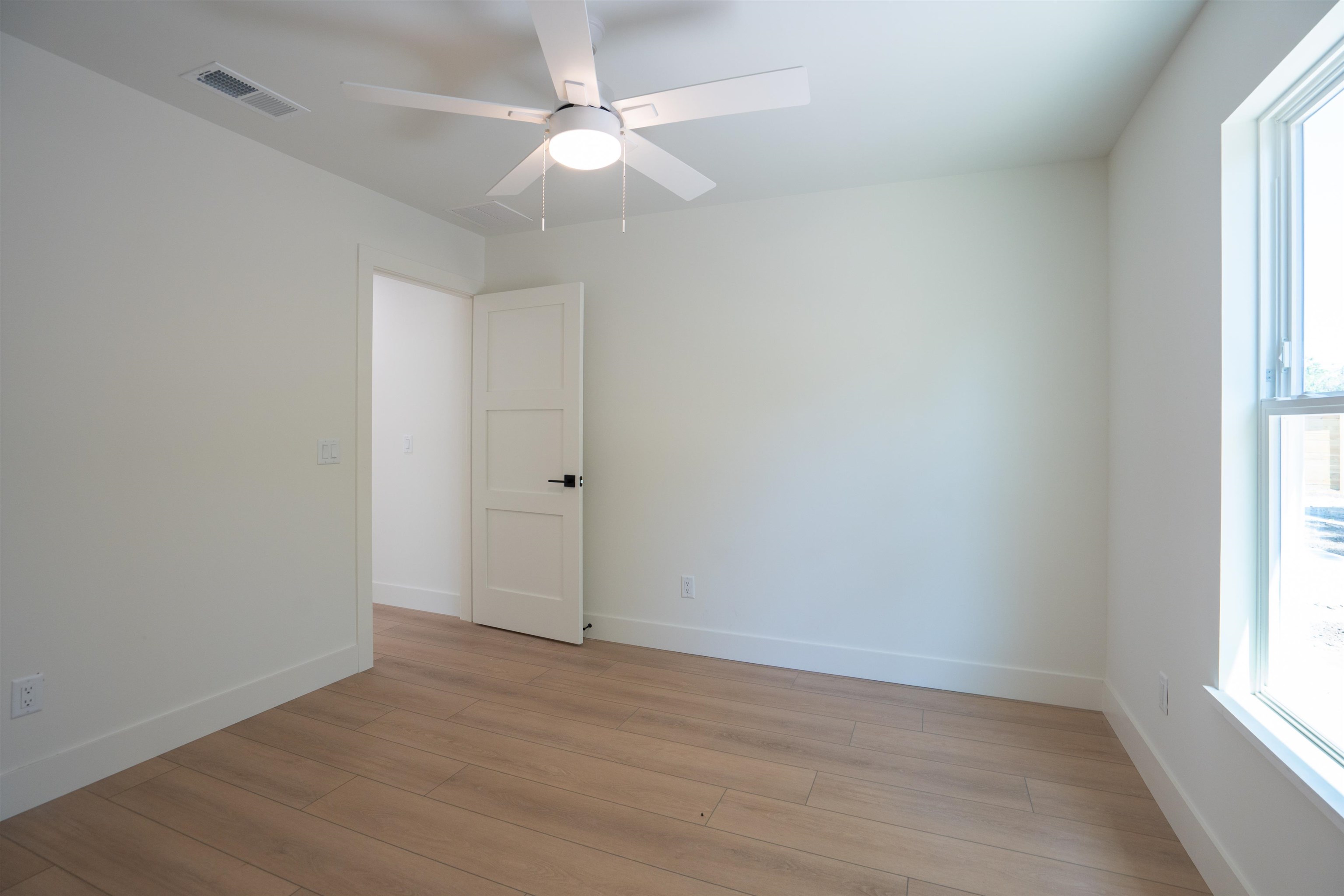 411 Royal Road St. Augustine, FL 32086 - Photo 18 of 43 wooden floor in an empty room with a window