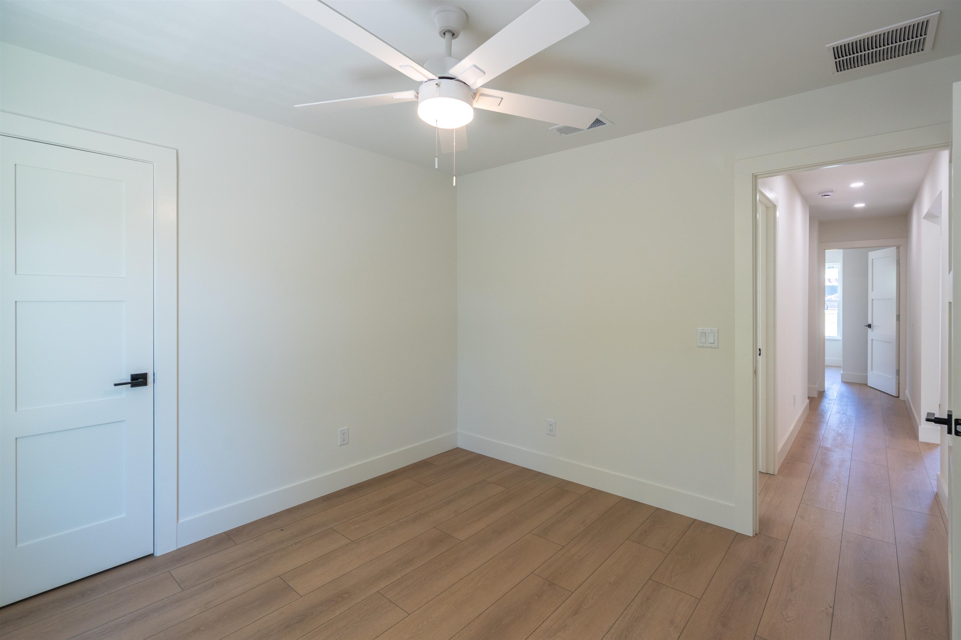 411 Royal Road St. Augustine, FL 32086 - Photo 19 of 43 a view of an empty room with wooden floor