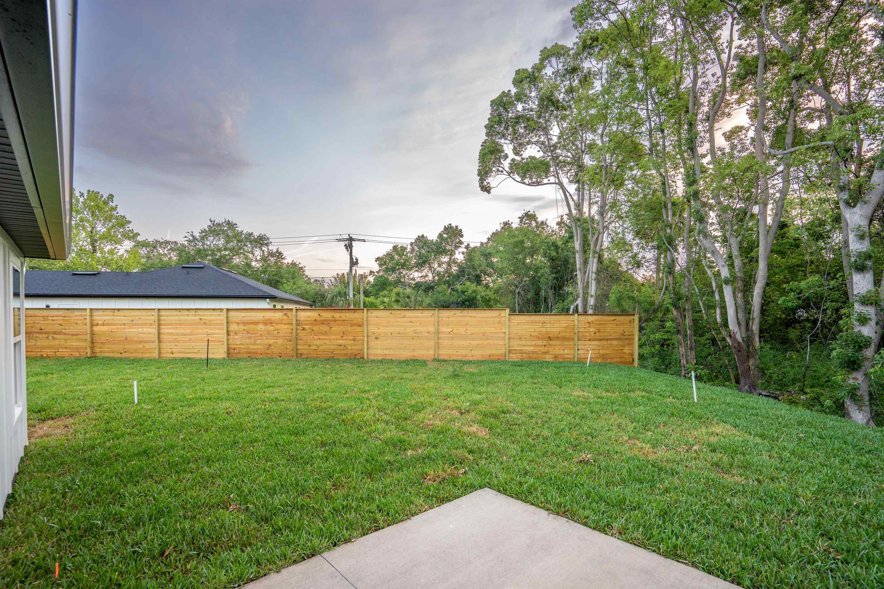 411 Royal Road St. Augustine, FL 32086 - Photo 7 of 43 a backyard of a house with lots of green space