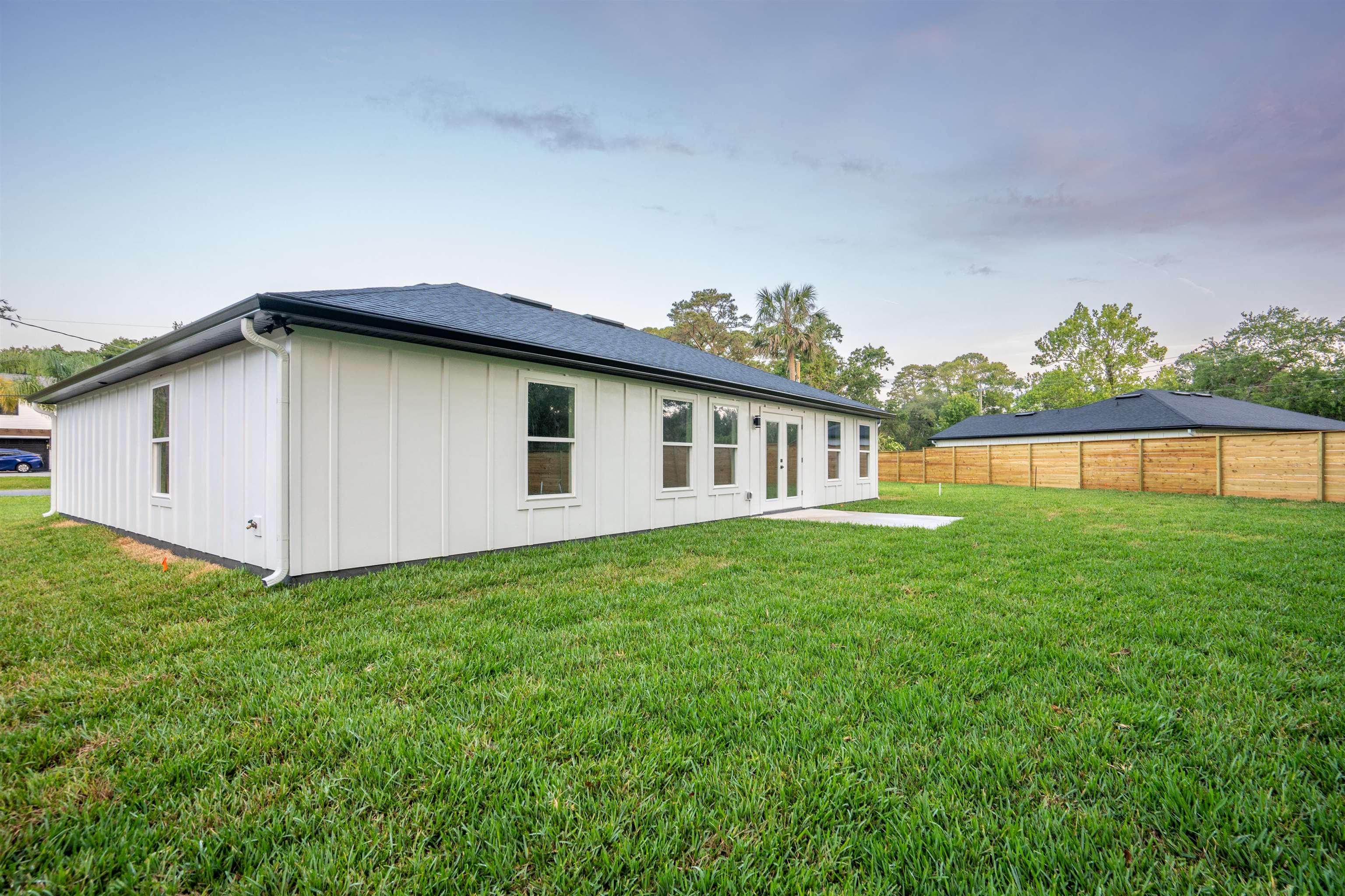 411 Royal Road St. Augustine, FL 32086 - Photo 9 of 43 a view of a house with backyard and garden