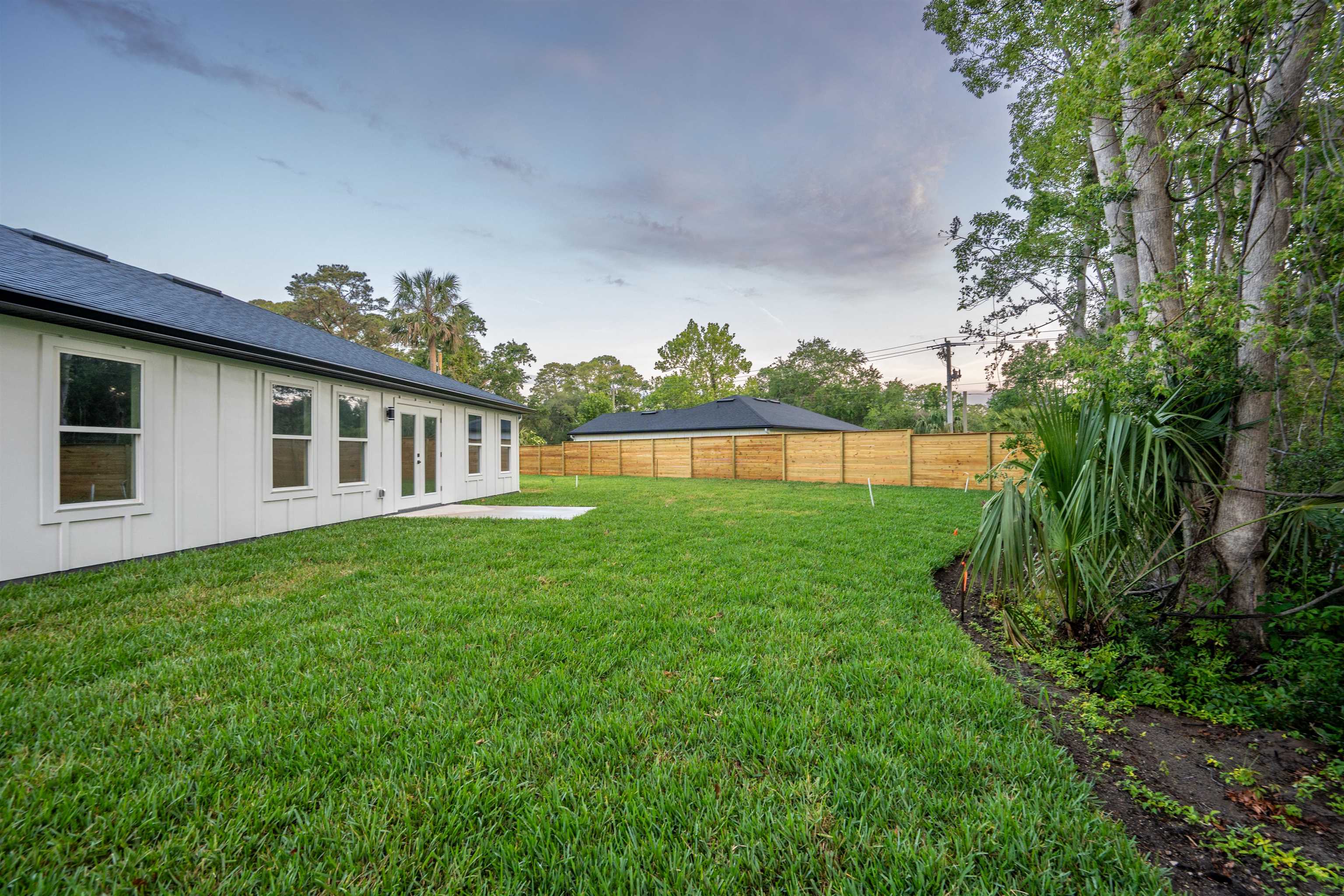 411 Royal Road St. Augustine, FL 32086 - Photo 10 of 43 a view of a house with backyard and garden