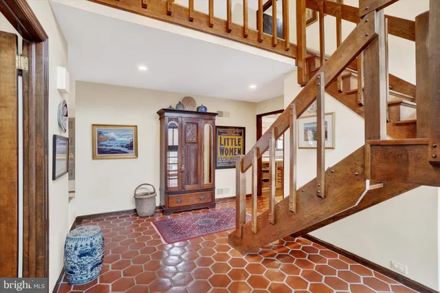 a view of an entryway with wooden floor