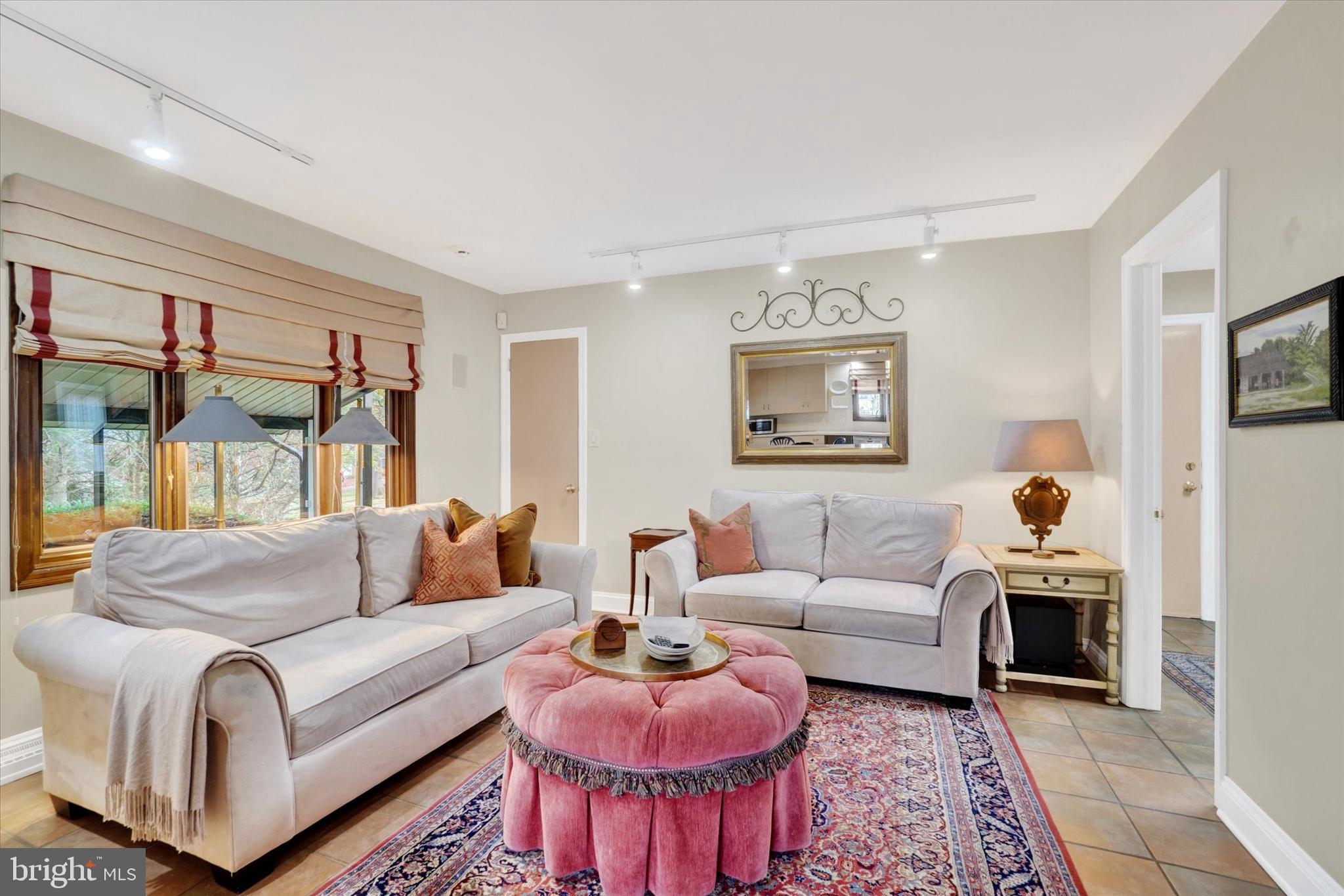 811 Michigan Avenue Lemoyne, PA 17043 - Photo 15 of 47 a living room with furniture potted plant and a large window