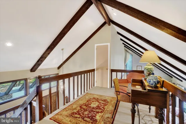 a balcony with furniture and wooden floor