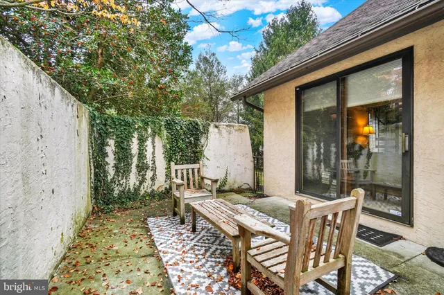a view of an outdoor sitting area with furniture