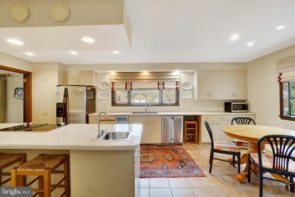 a kitchen with a stove and cabinets