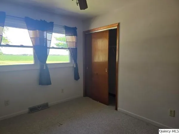 a view of an empty room and window