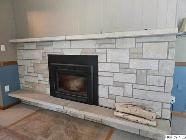 a living room with a fireplace