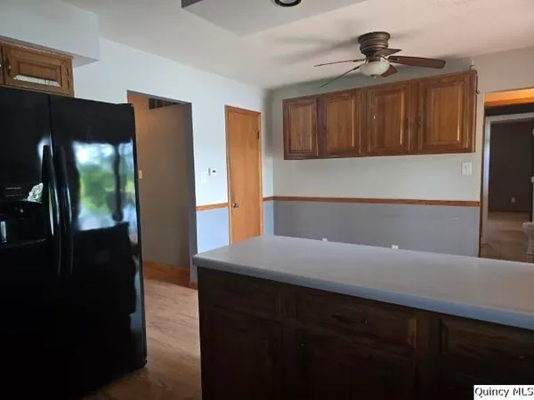 a kitchen with a refrigerator and a sink