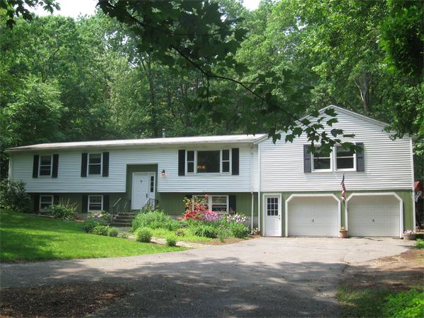 645 Depot Road Boxborough, MA 01719 - Photo 1 of 1 a front view of a house with a garden