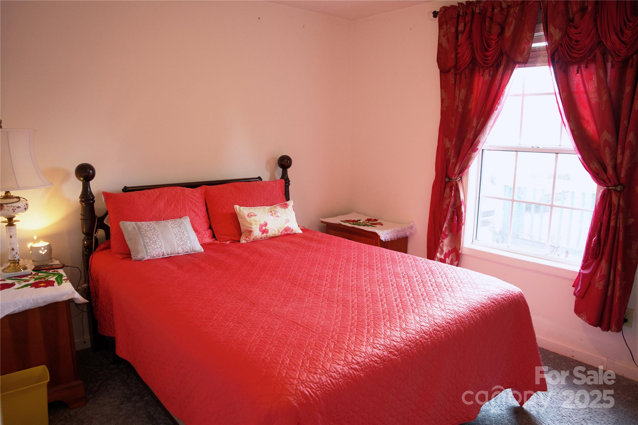3372 Summer Road Hendersonville, NC 28792 - Photo 3 of 11 a bed sitting in a bedroom next to a window