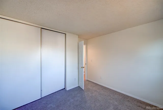 a view of an empty room with stairs