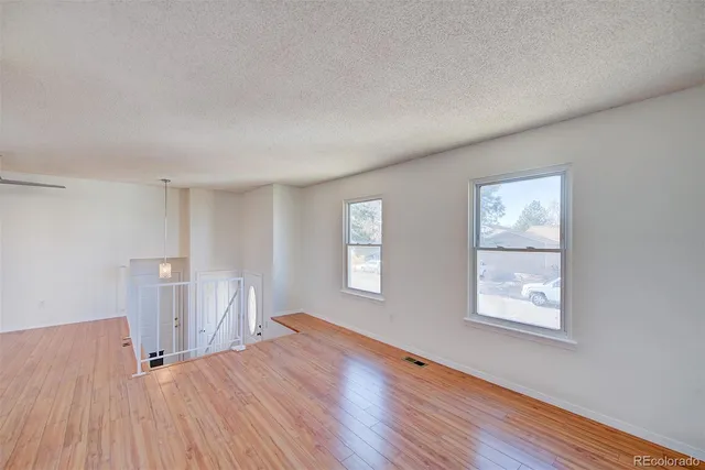 a view of an entryway with wooden floor