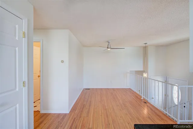 a kitchen with granite countertop a sink stove and refrigerator