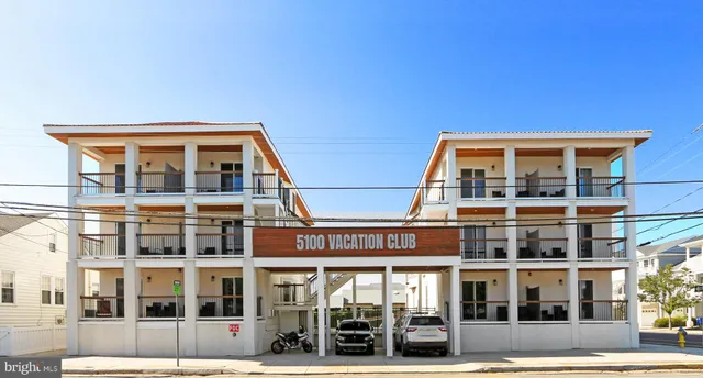 a view of a swimming pool with outdoor seating