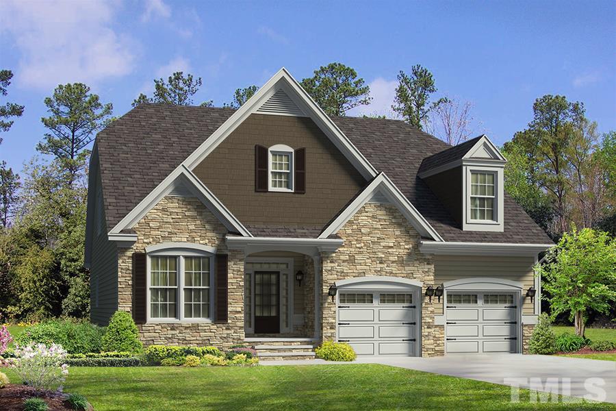 7724 Wilderness Road Raleigh, NC 27613 - Photo 1 of 7 a front view of a house with a yard