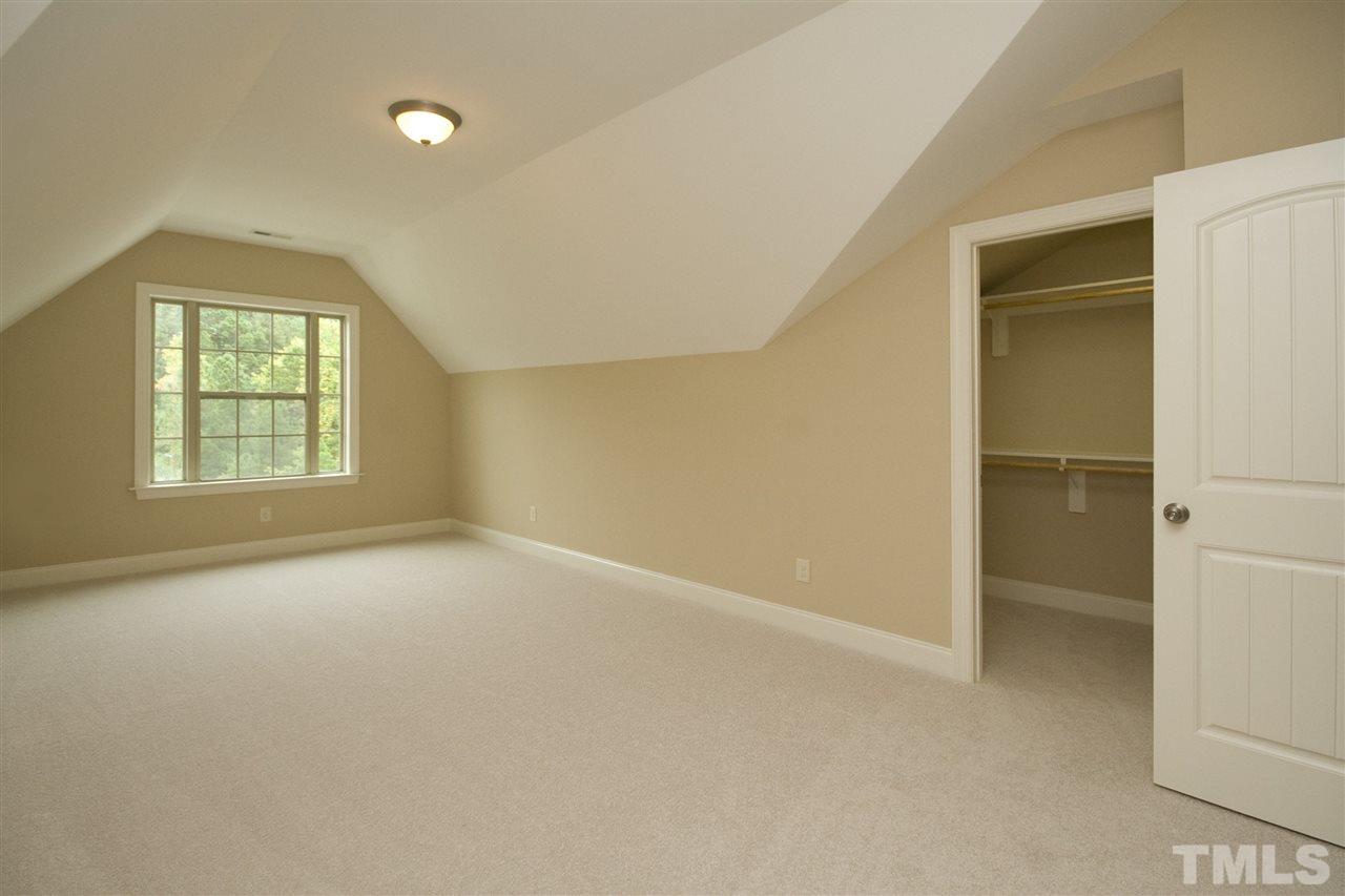 7724 Wilderness Road Raleigh, NC 27613 - Photo 6 of 7 an empty room with windows and closet