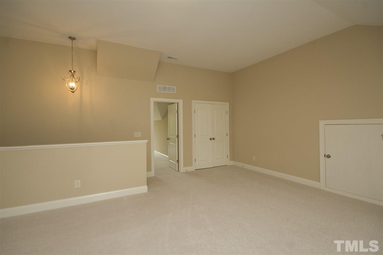 7724 Wilderness Road Raleigh, NC 27613 - Photo 7 of 7 a view of an empty room