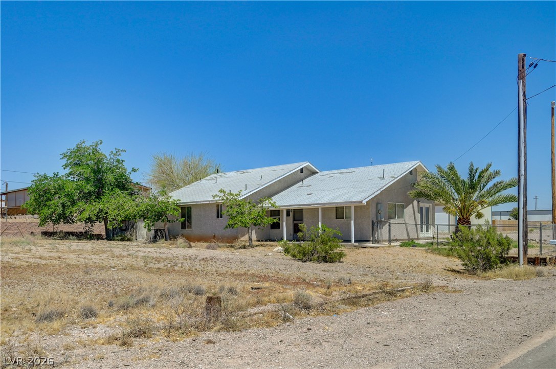 590 East Encinitas Street Searchlight, NV 89046 - Photo 1 of 39 This charming residence offers a peaceful retreat amidst natural surroundings, perfect for serene living.