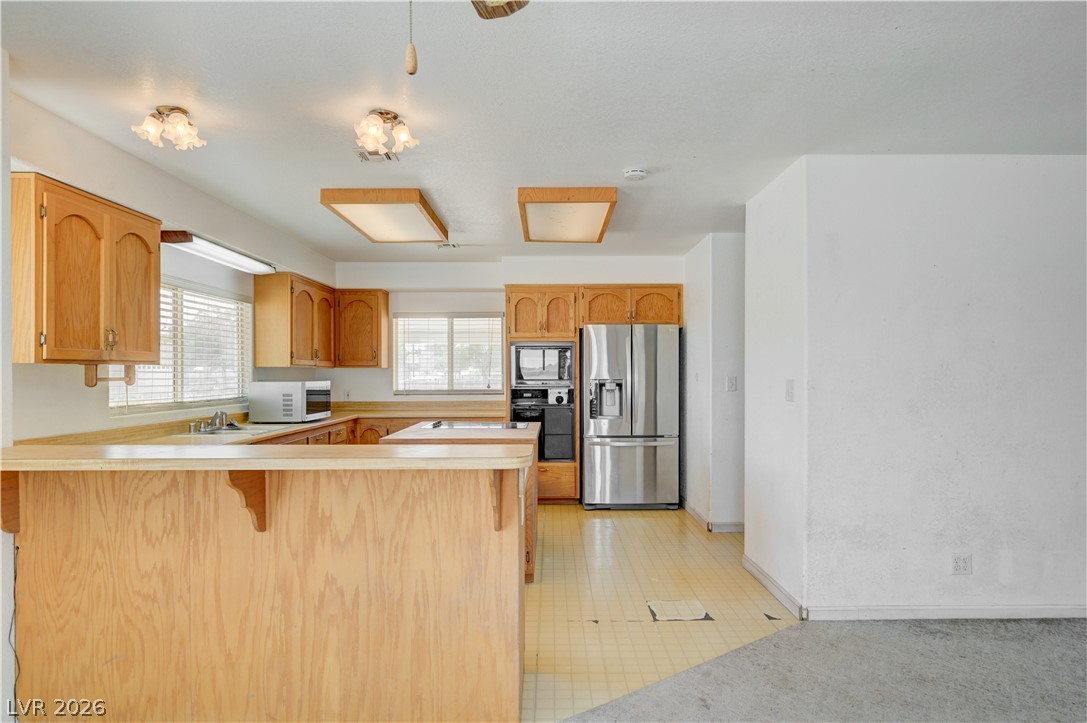 590 East Encinitas Street Searchlight, NV 89046 - Photo 11 of 39 This spacious kitchen offers ample cabinetry and an inviting breakfast bar.