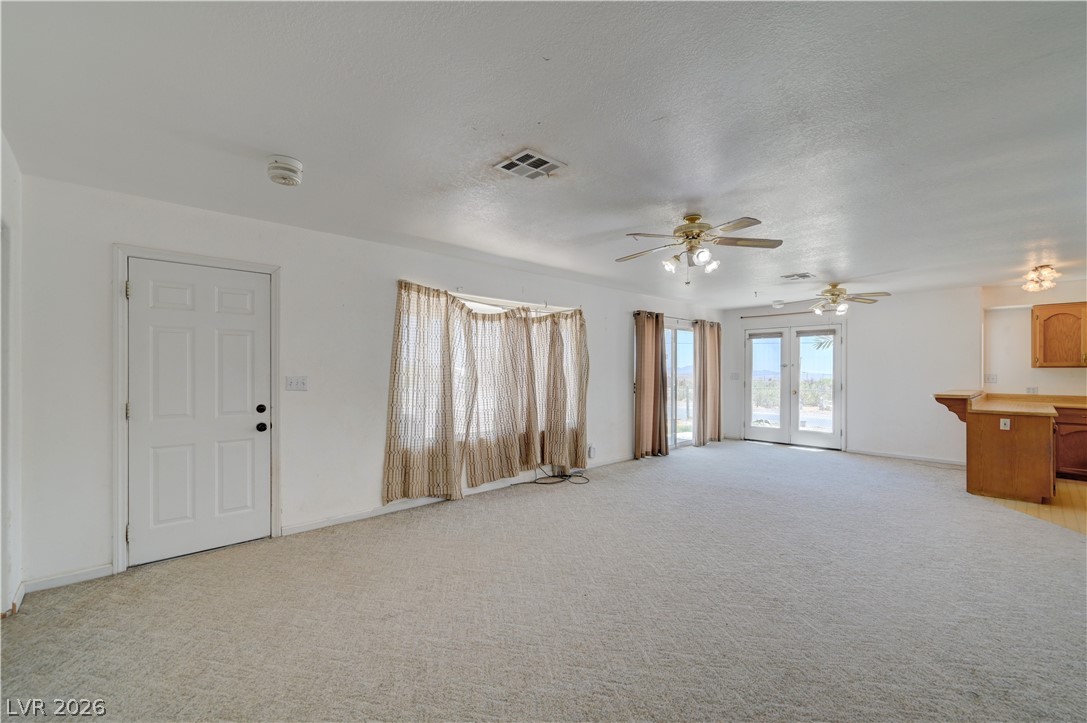 590 East Encinitas Street Searchlight, NV 89046 - Photo 14 of 39 Bright and airy living space offering direct access to the outdoors.