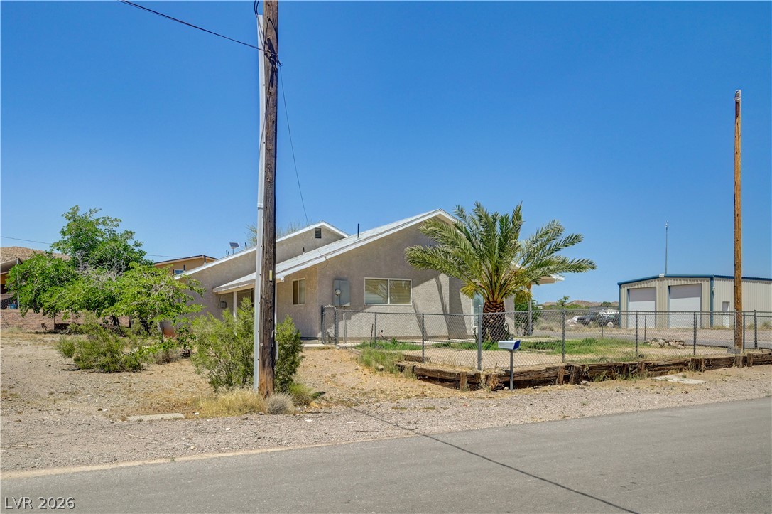 590 East Encinitas Street Searchlight, NV 89046 - Photo 21 of 39 This desert dwelling offers spacious outdoor potential, ready for personalization.