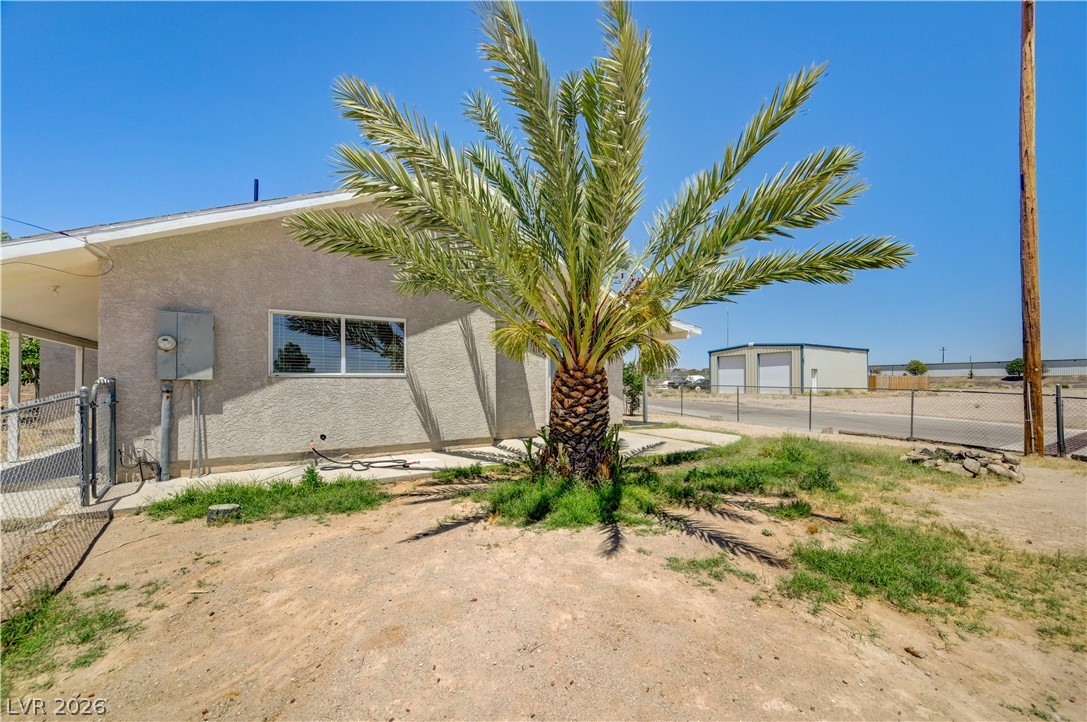 590 East Encinitas Street Searchlight, NV 89046 - Photo 27 of 39 This charming home offers a private yard and classic stucco exterior, perfect for desert living.