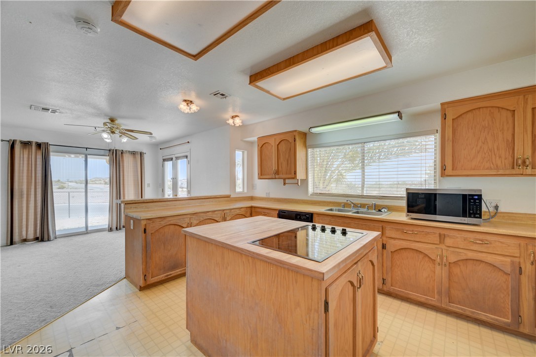 590 East Encinitas Street Searchlight, NV 89046 - Photo 3 of 39 This spacious kitchen offers a seamless flow into the living area, ideal for entertaining.