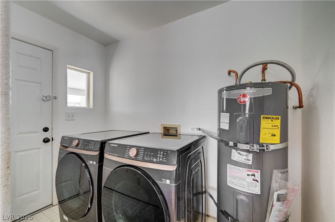590 East Encinitas Street Searchlight, NV 89046 - Photo 31 of 39 This dedicated laundry room includes modern appliances and a hot water heater for efficient living.