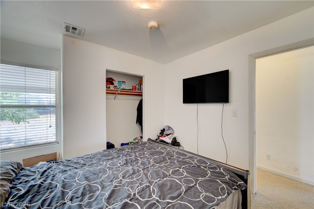 590 East Encinitas Street Searchlight, NV 89046 - Photo 38 of 39 This cozy bedroom provides a comfortable retreat with a convenient closet for storage.