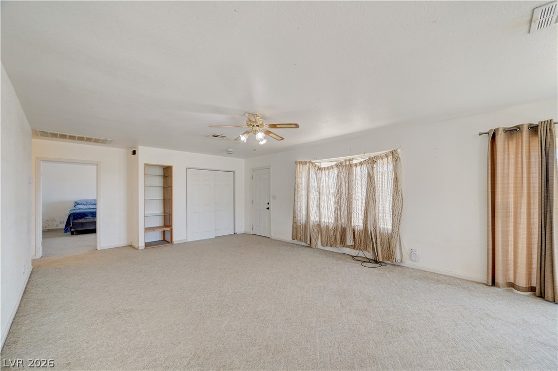 590 East Encinitas Street Searchlight, NV 89046 - Photo 4 of 39 This living area offers abundant space and natural light, perfect for everyday comfort.