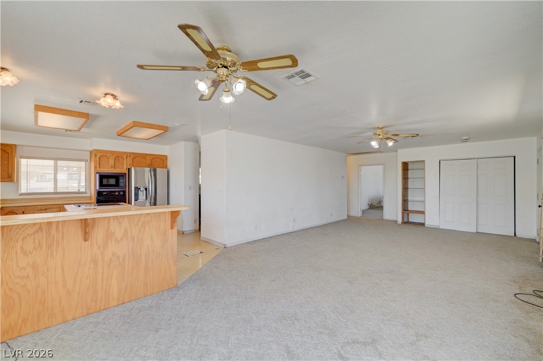 590 East Encinitas Street Searchlight, NV 89046 - Photo 5 of 39 Bright and airy living area with seamless flow to the kitchen, perfect for comfortable daily living.