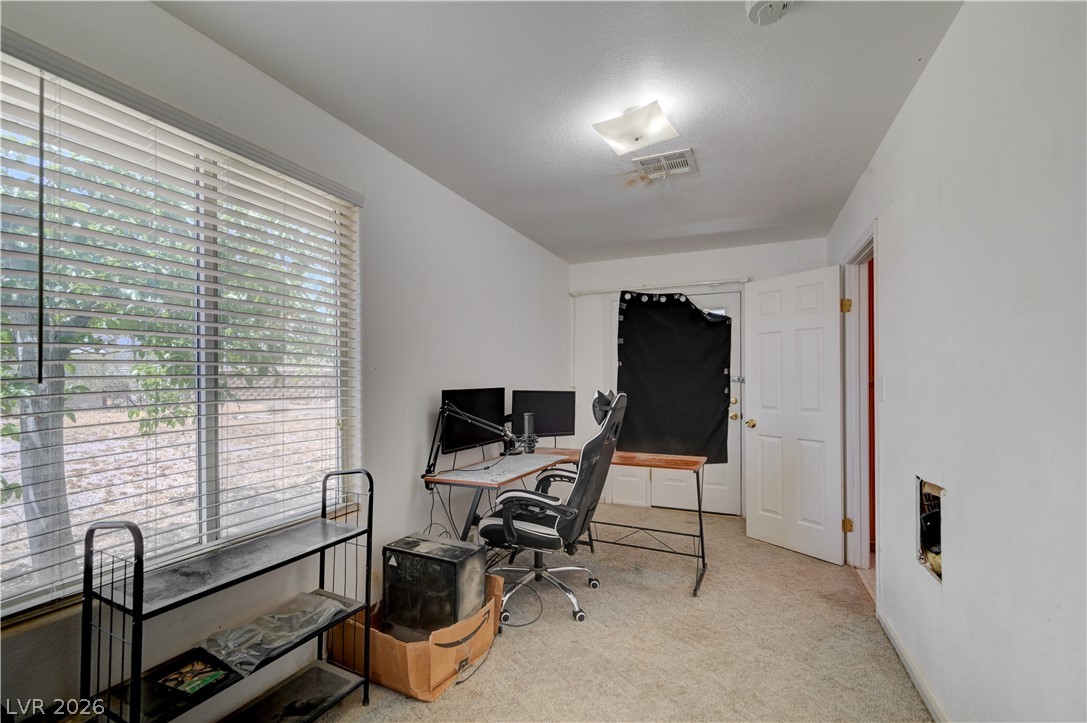 590 East Encinitas Street Searchlight, NV 89046 - Photo 9 of 39 This versatile room features natural light, offering endless possibilities for use.