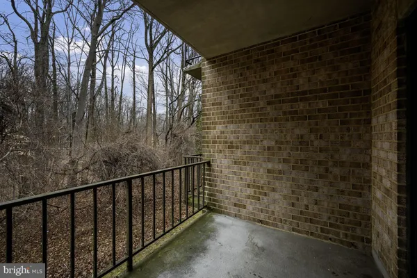 a view of balcony with wooden floor
