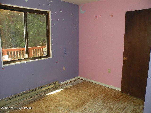 703 Edgewood Road Tobyhanna, PA 18466 - Photo 11 of 17 a view of an empty room with a window