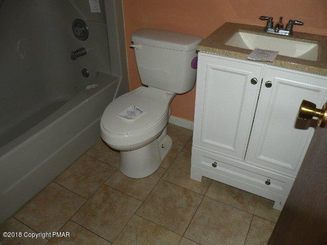703 Edgewood Road Tobyhanna, PA 18466 - Photo 12 of 17 a bathroom with a toilet and a sink