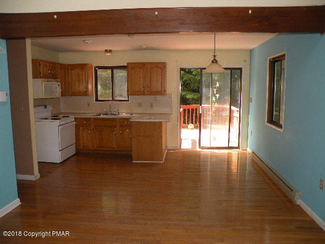 703 Edgewood Road Tobyhanna, PA 18466 - Photo 3 of 17 a large kitchen with cabinets a sink and dishwasher