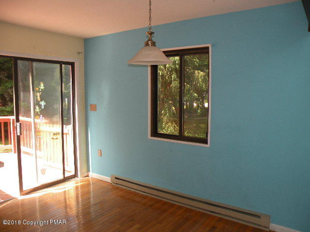 703 Edgewood Road Tobyhanna, PA 18466 - Photo 4 of 17 a front door with wooden floor and a window