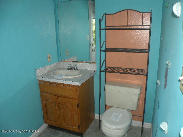 703 Edgewood Road Tobyhanna, PA 18466 - Photo 8 of 17 a bathroom with a toilet and a sink