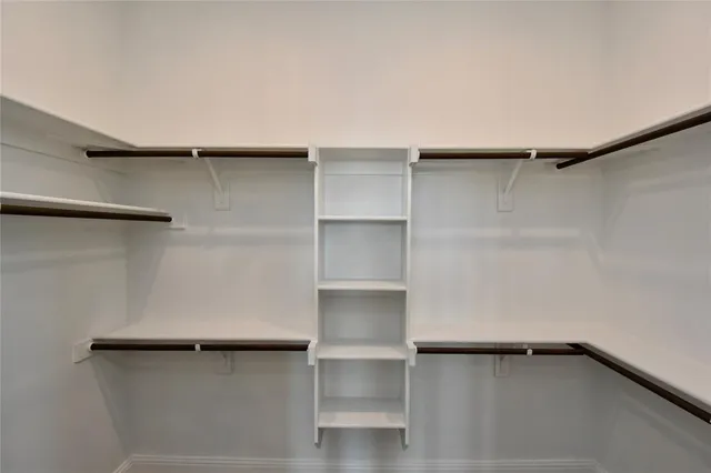 a view of an empty walk in closet