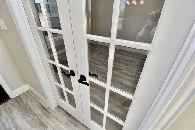 a view of staircase with white walls and a window