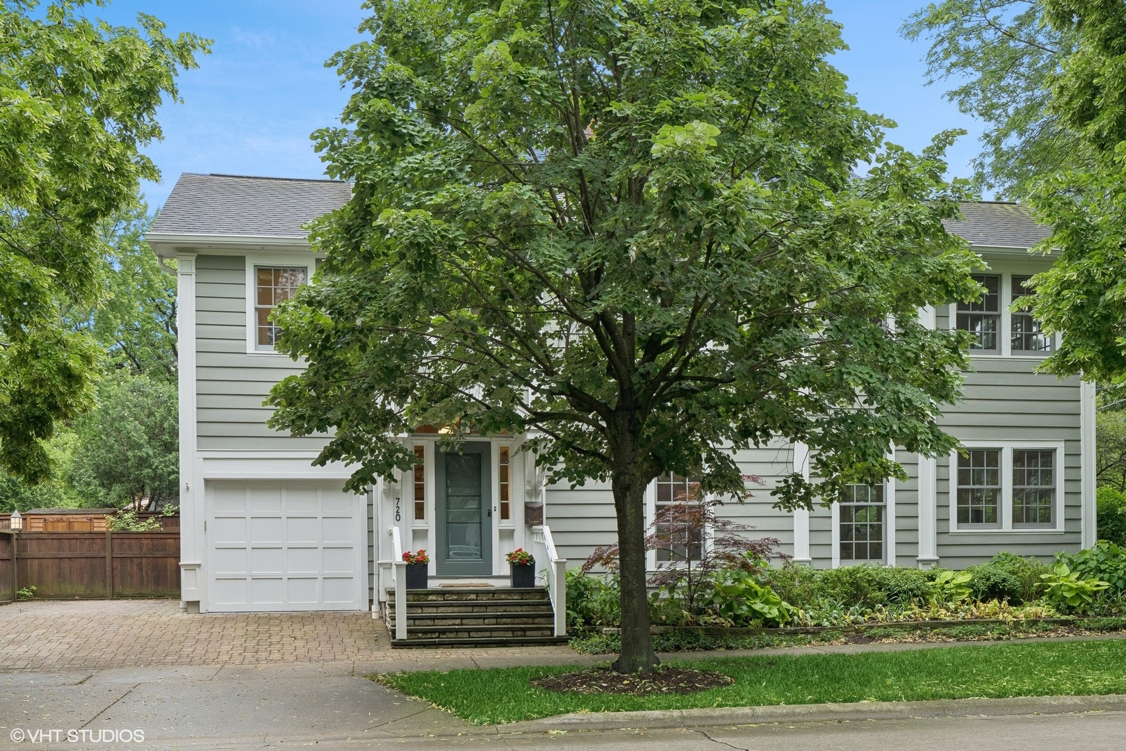 720 Willow Road Winnetka, IL 60093 - Photo 2 of 60 front view of a house with a tree