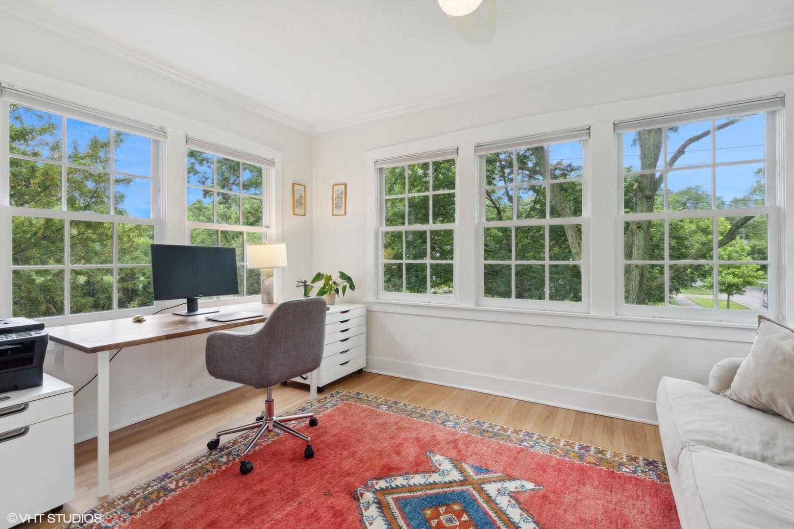 720 Willow Road Winnetka, IL 60093 - Photo 26 of 60 a living room with furniture floor to ceiling window hardwood floor and a rug